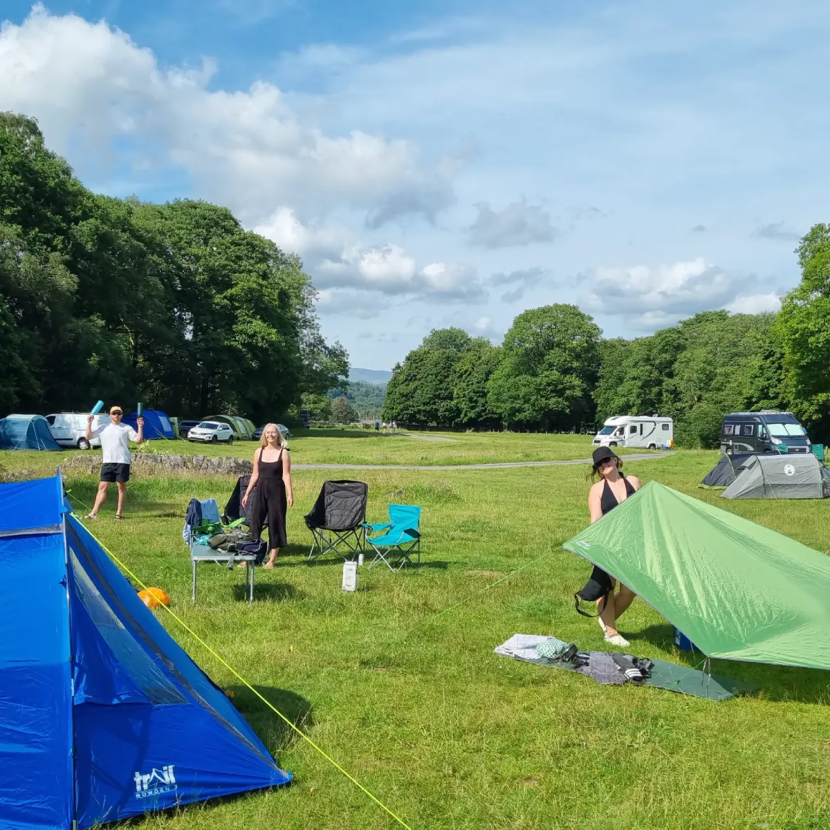 tents being put up at a camp site