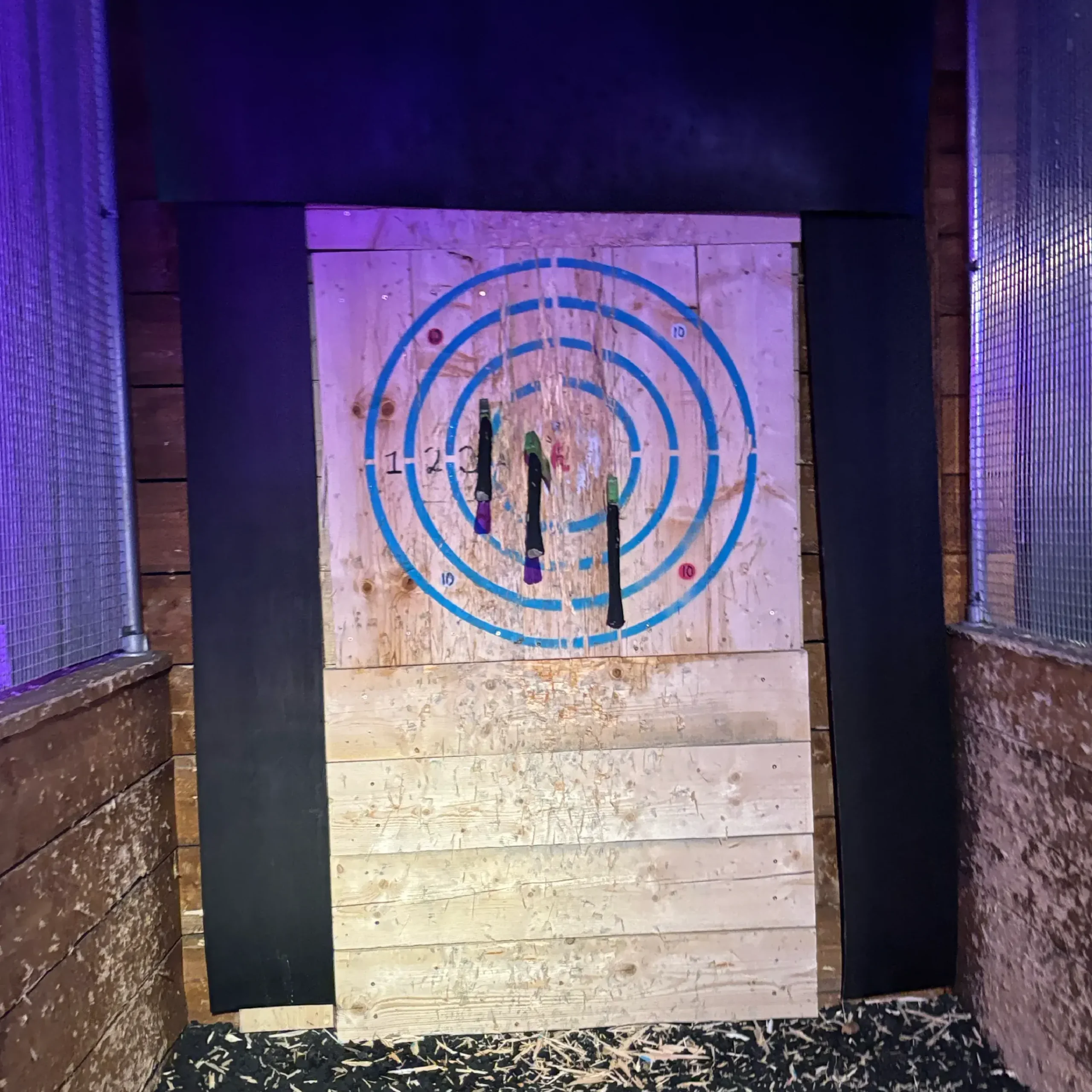 three axes on target at axe throwing