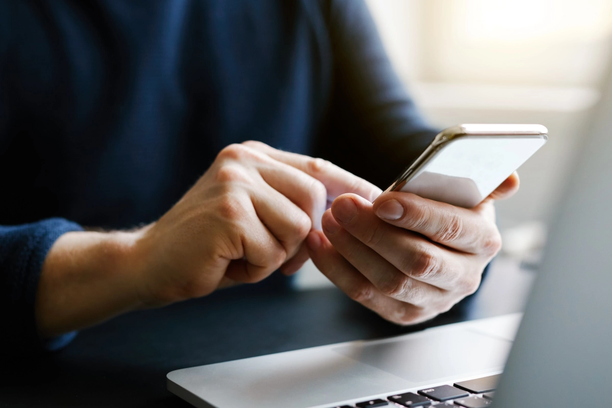 someone tapping on an app on their phone