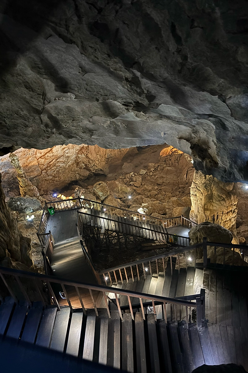 the view of the steps down in a dry cave