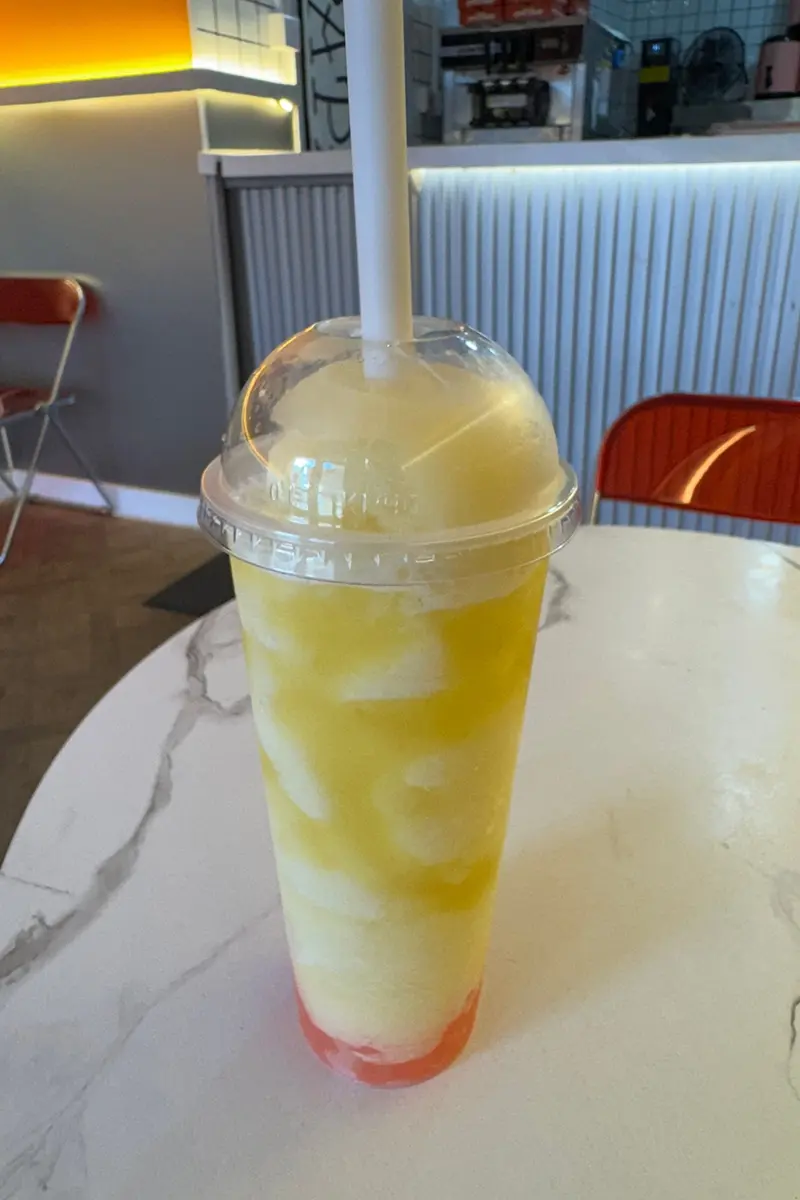 Pineapple smoothie with strawberry popping boba