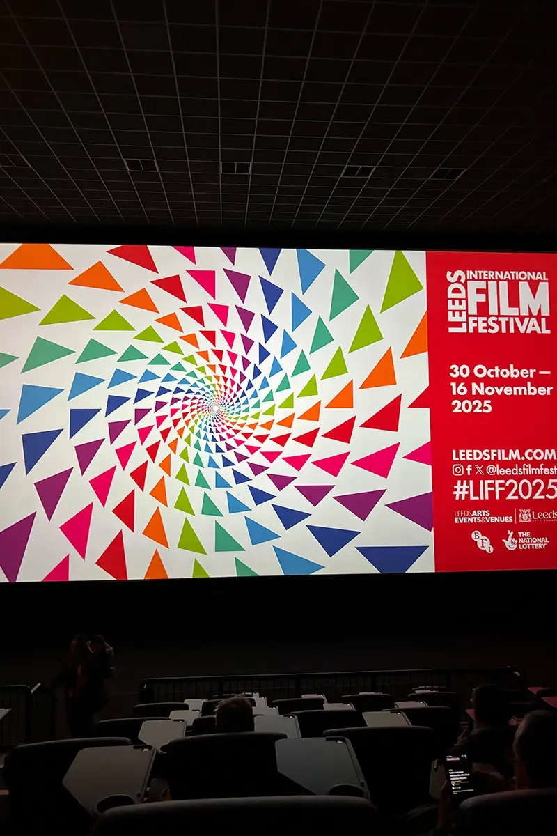 Leeds International Film Festival logo on a cinema screen in the light, Leeds