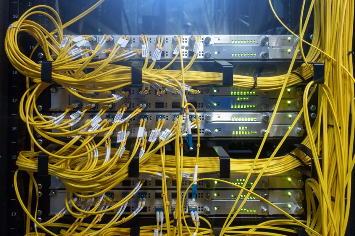 Yellow fibre optic cables connected to a server patch panel