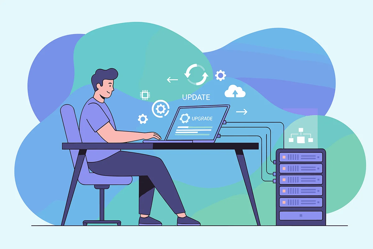 a man sat at a desk updating a server