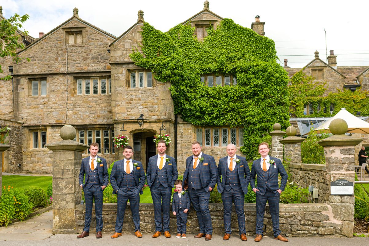 our digital marketing guy at a wedding with other groomsmen