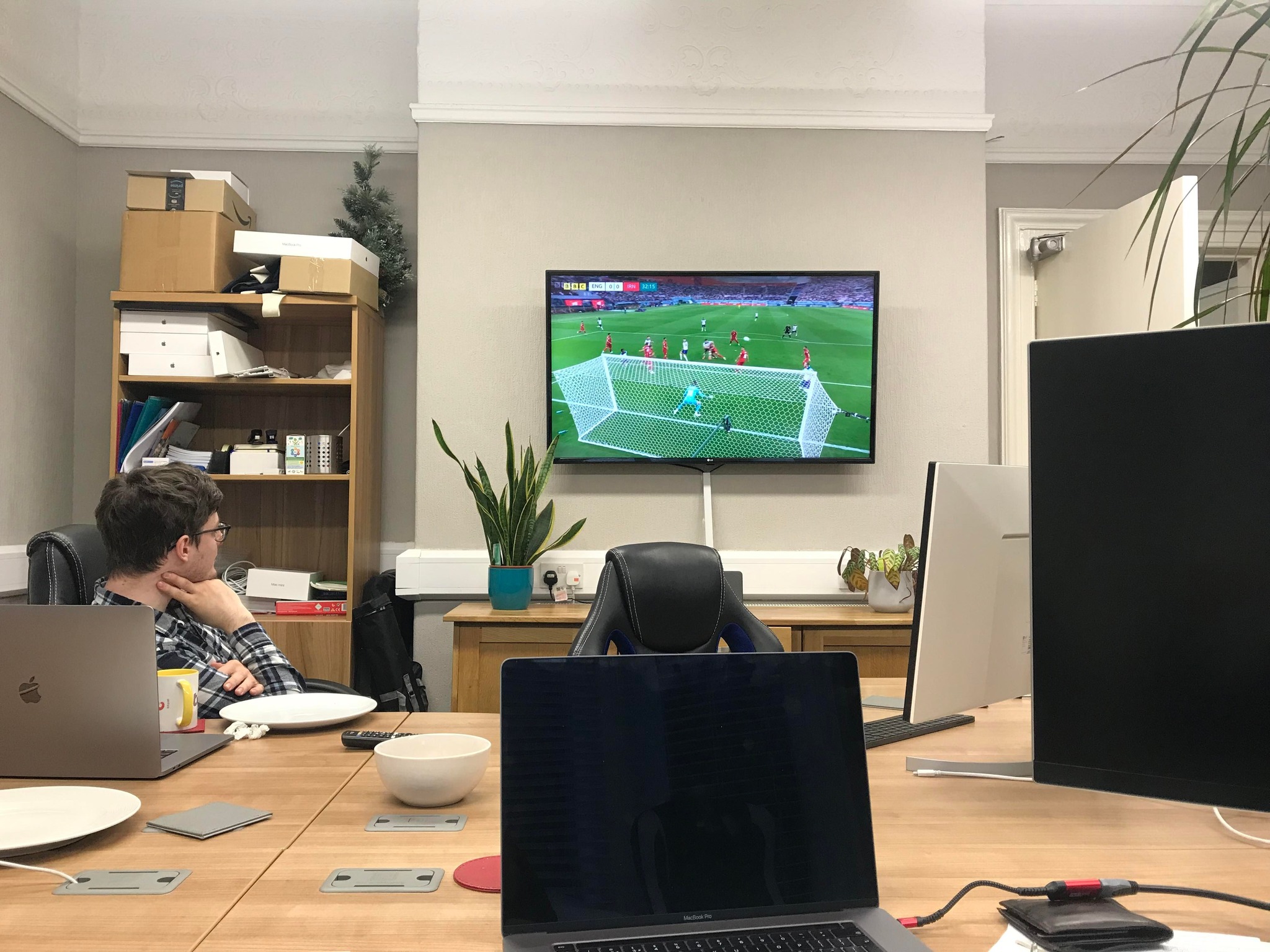 england vs iran at the football world cup on a tv in an office