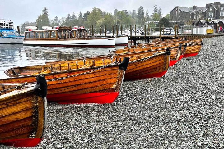 Lake windermere with boats pushed up onto the shore