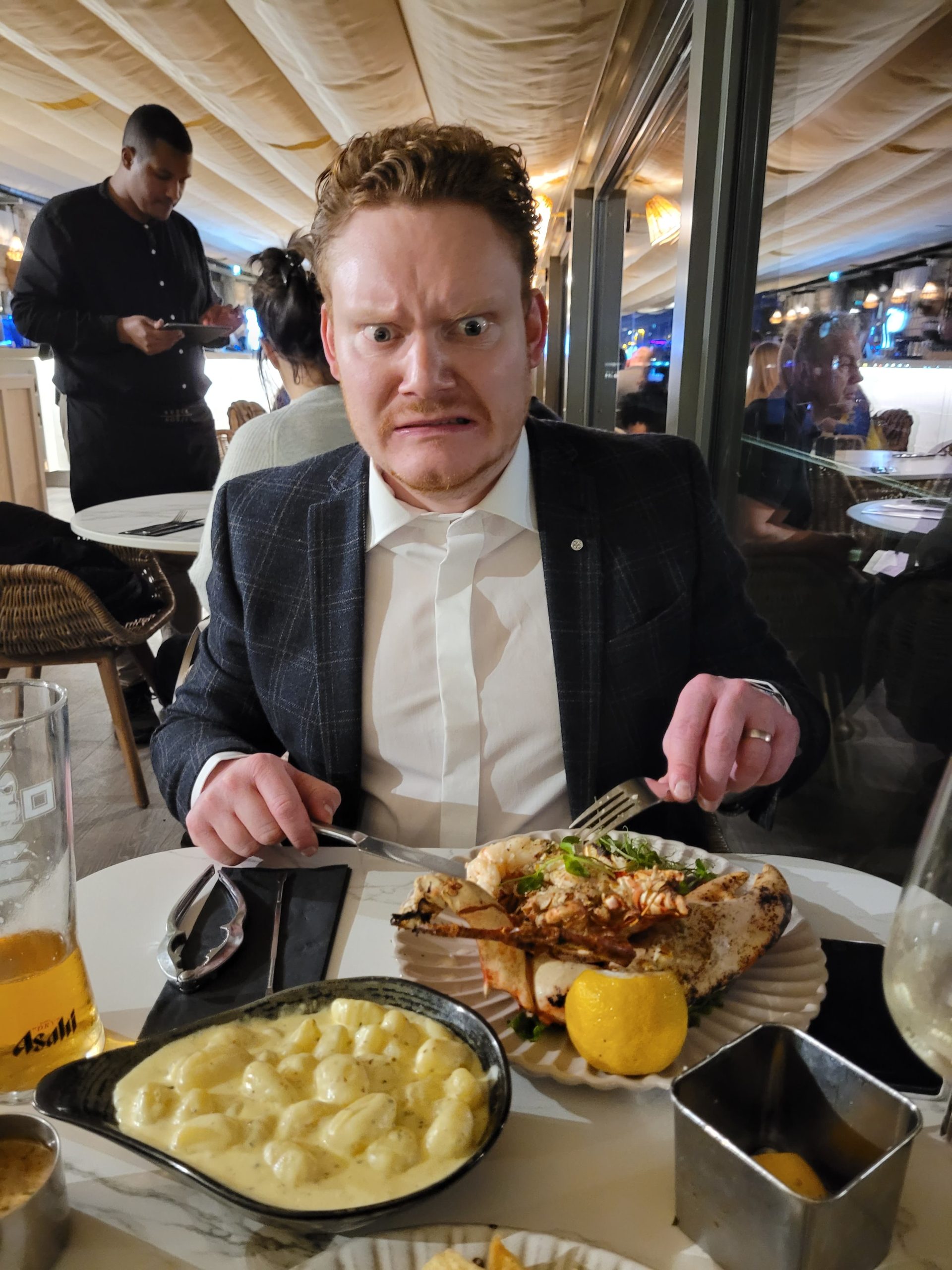 a table of food including gnocchi and lobster