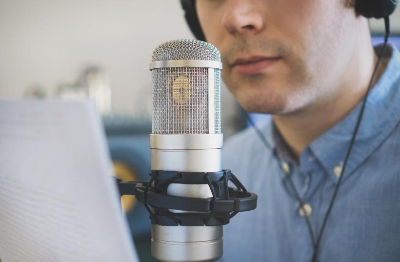 man recording a radio advert