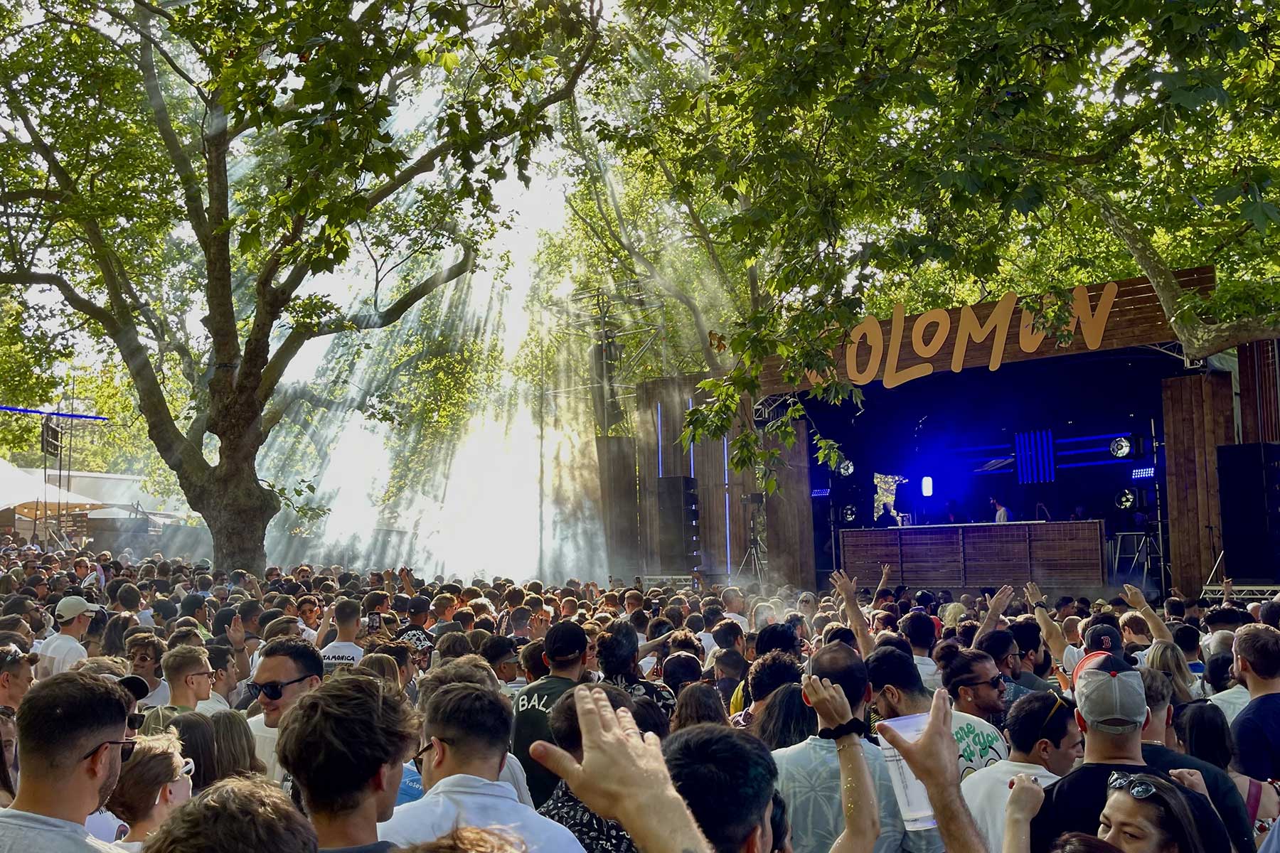 A crowd outdoors watching Solomun