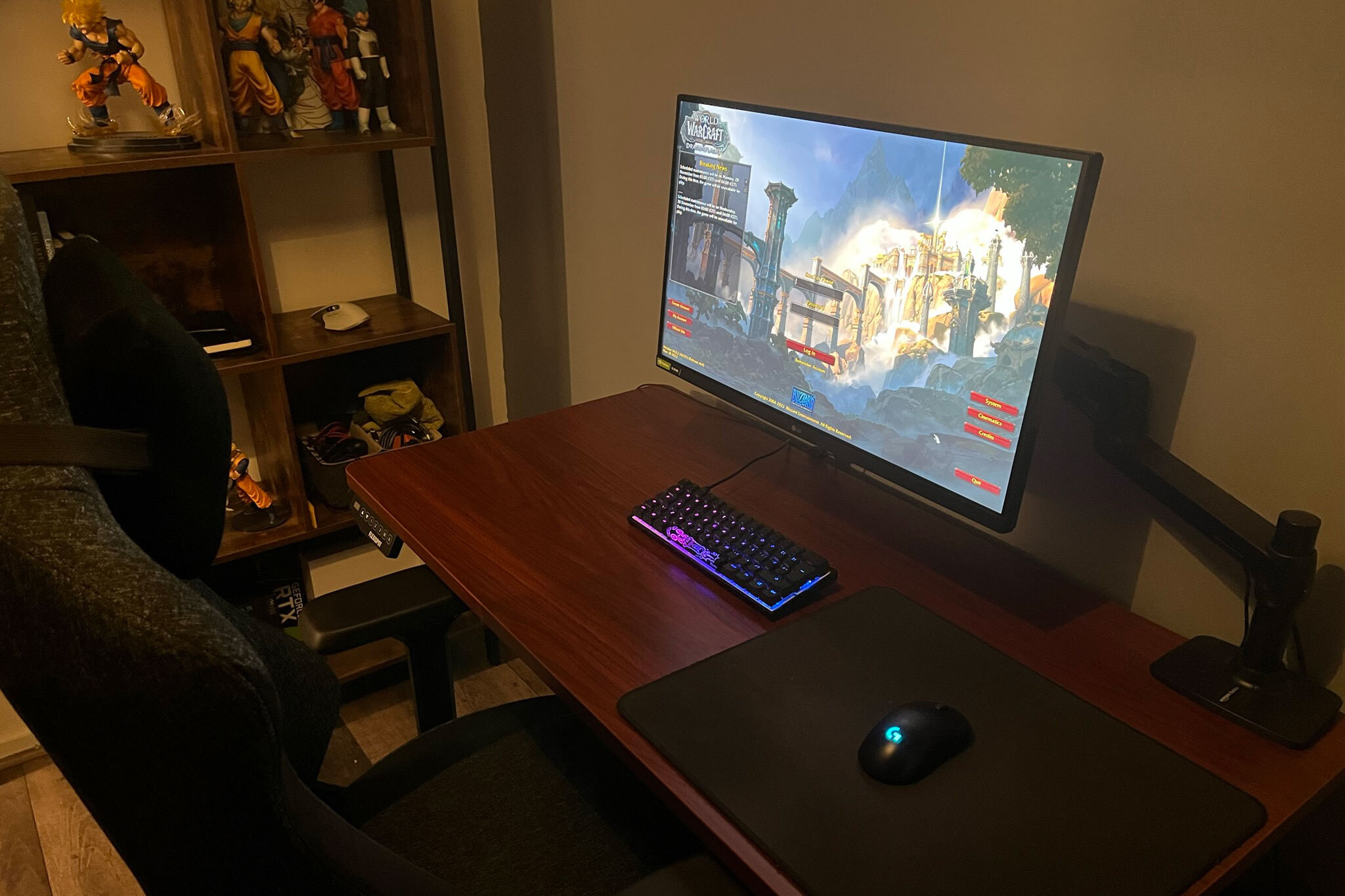a pc gaming set up with world of warcraft on the monitor.