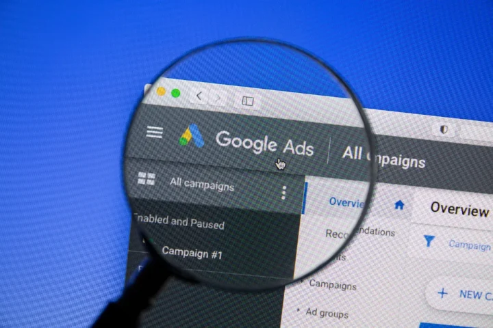 a magnifying glass over a google ads account